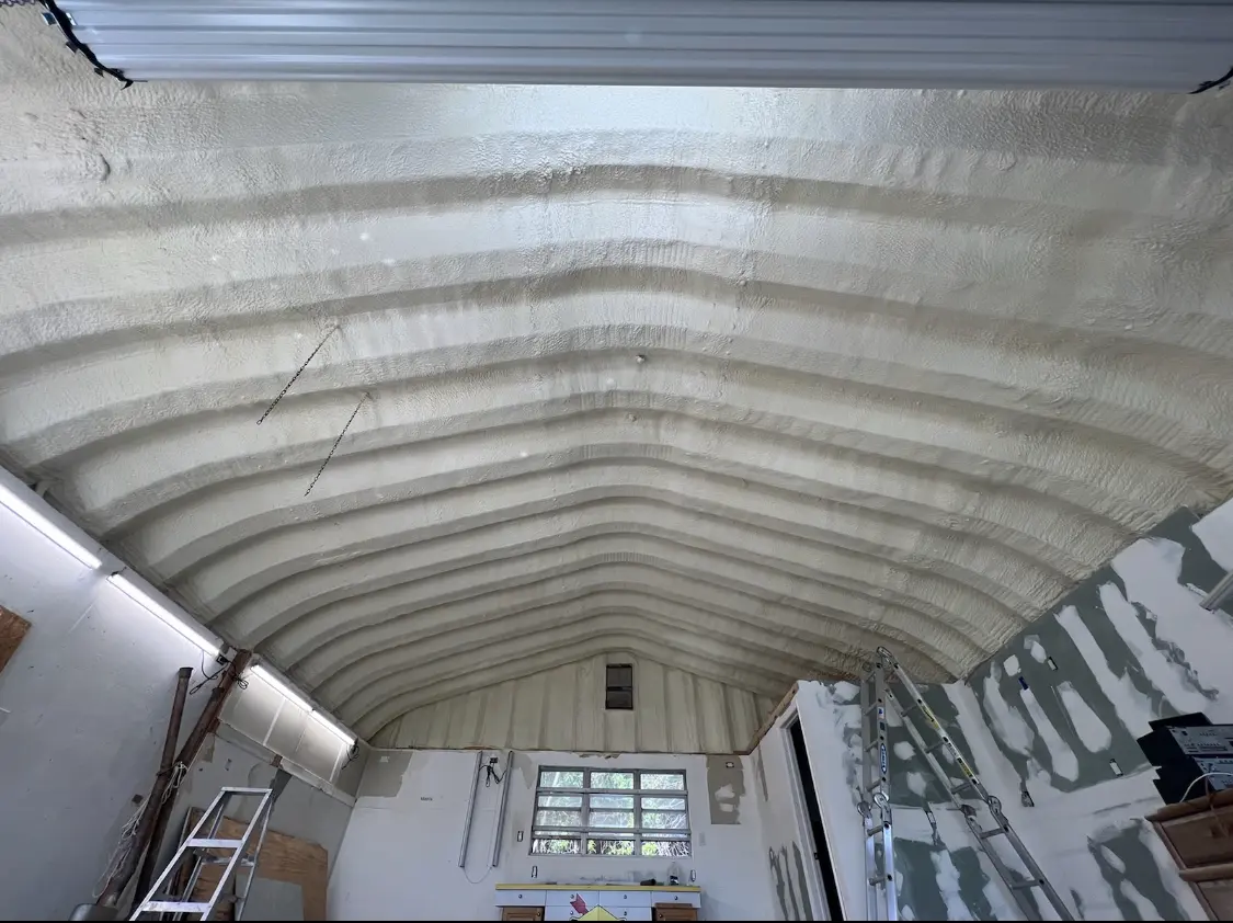 Spray polyurethane foam applied to the underside of a metal roof deck in Cornelius